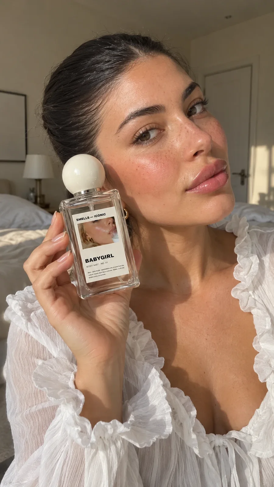 Holding a bottle of Babygirl body mist
